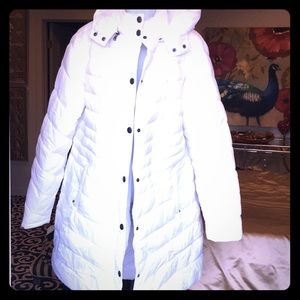 White puffy jacket with snaps and a zipper. W/hood